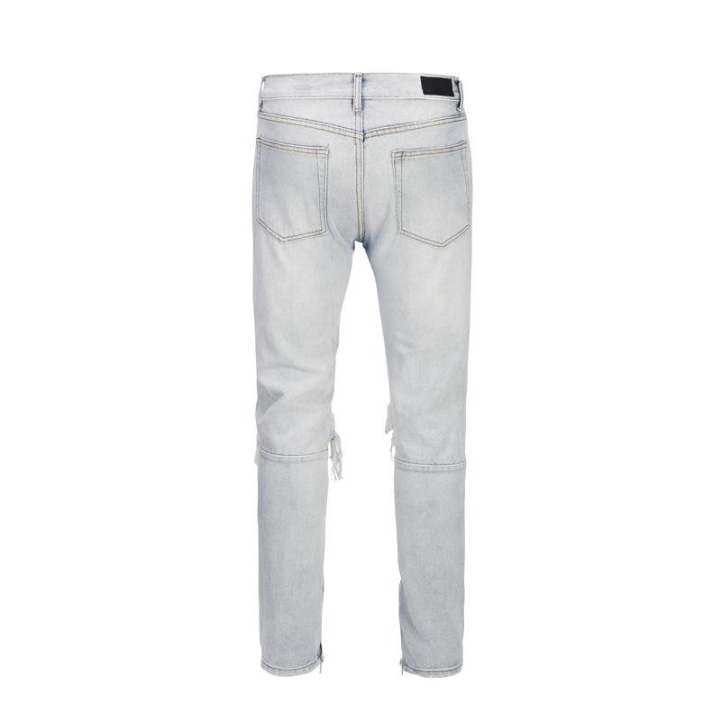 Licht denim gescheurd