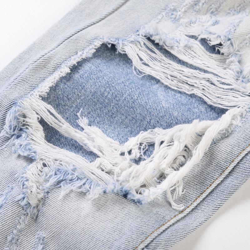 Licht denim gescheurd