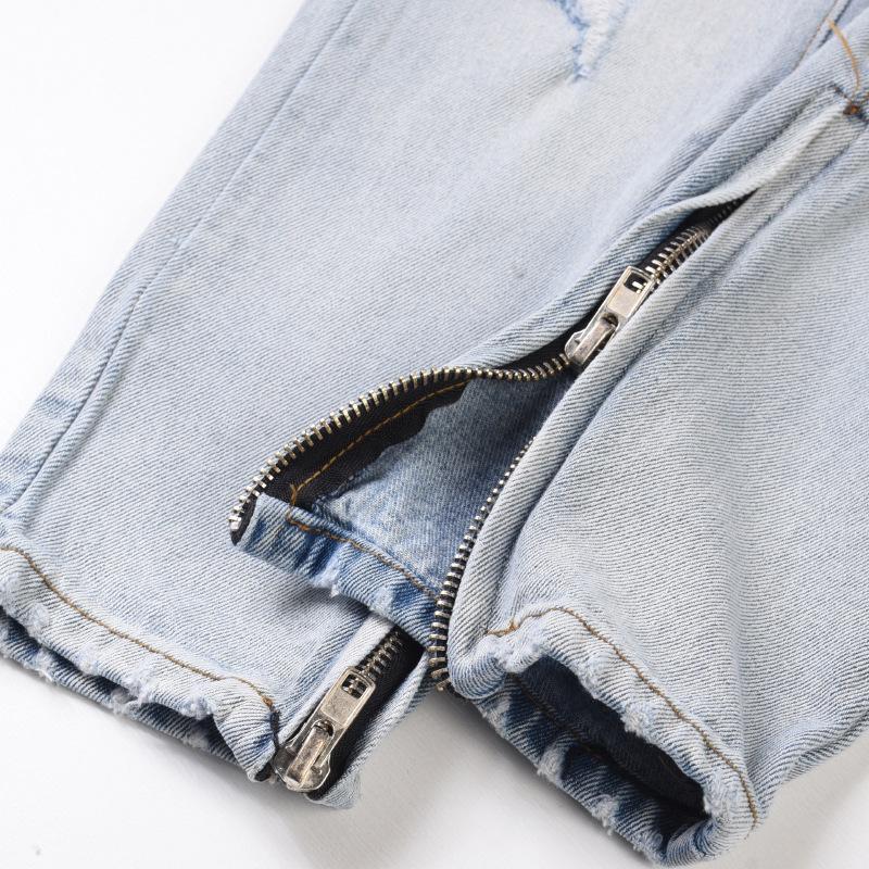 Licht denim gescheurd