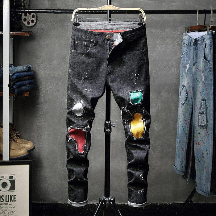 Zwarte jeans met kleurrijke patch