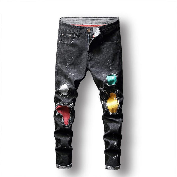 Zwarte jeans met kleurrijke patch