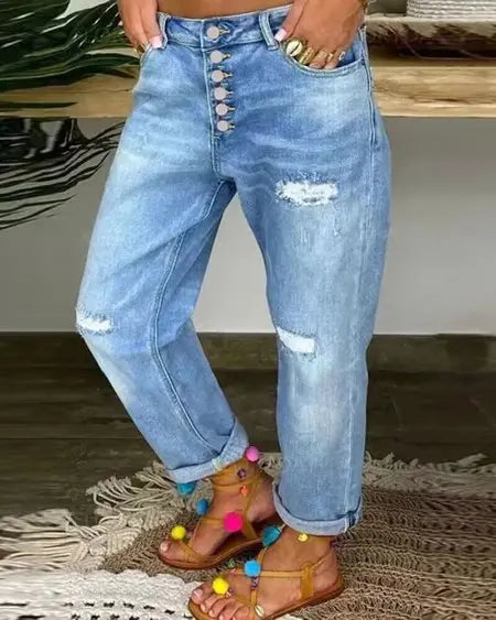 Jeans rasgados de cintura baja con bragueta de botones 