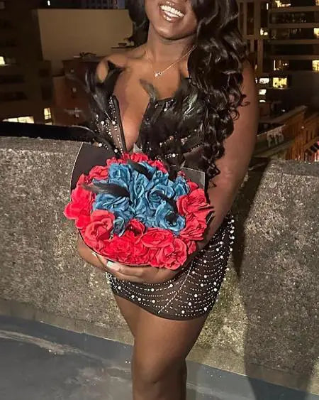 Vestido de fiesta bandeau con plumas y pedrería 