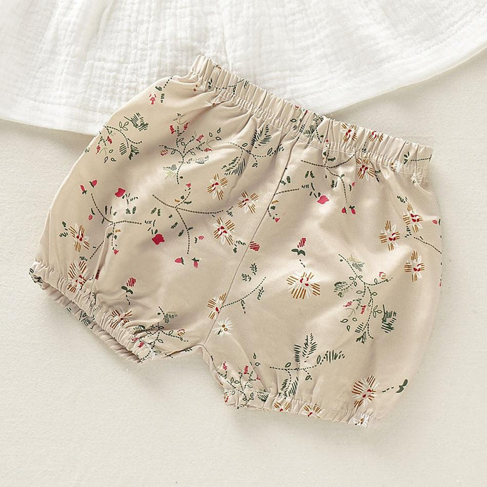 Conjunto de bebé de lino con top liso y shorts florales