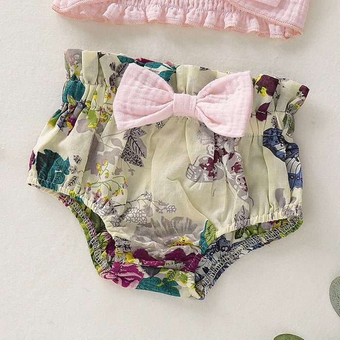 Conjunto de top con tiras y pantalones cortos florales de PP para bebé niña con elegante decoración de lazo