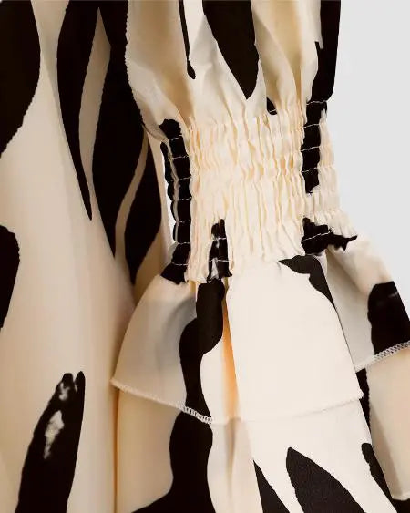 Off-shoulder jurk met abstracte print en plooien 