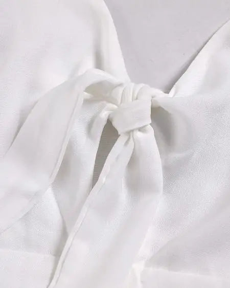 Maxi-jurk: knoopuitsparing met spaghettibandjes en knoopdetail 